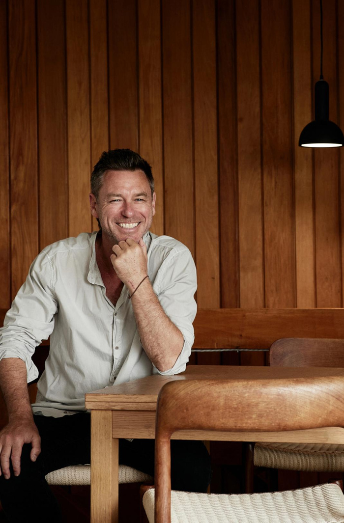 Cameron Foggo seated in his studio.